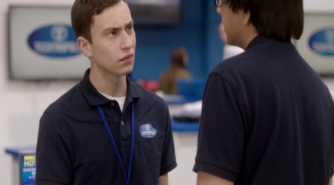 This is an image of Sam from Atypical talking to Zahid. Sam and Zahid are both wearing their Techtropolis uniforms.
